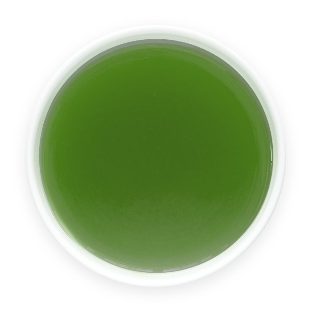 Prepared Aojiru Japanese green juice in a white cup viewed from above