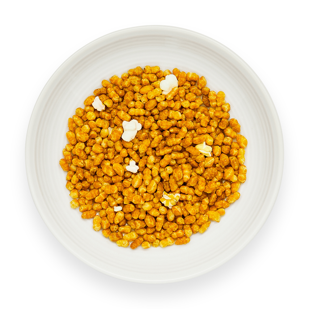 Genmaicha green tea Tsukimi loose brown rice tea with golden roasted rice and white mochi puffs in white dish top view bulk Japanese genmaicha