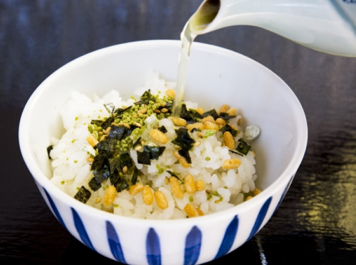 Pouring Ochazuke Green Tea Over Rice in a bowl