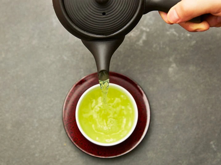 Serene Japanese green tea setting with loose-leaf sencha and traditional teaware for a mindful tea experience