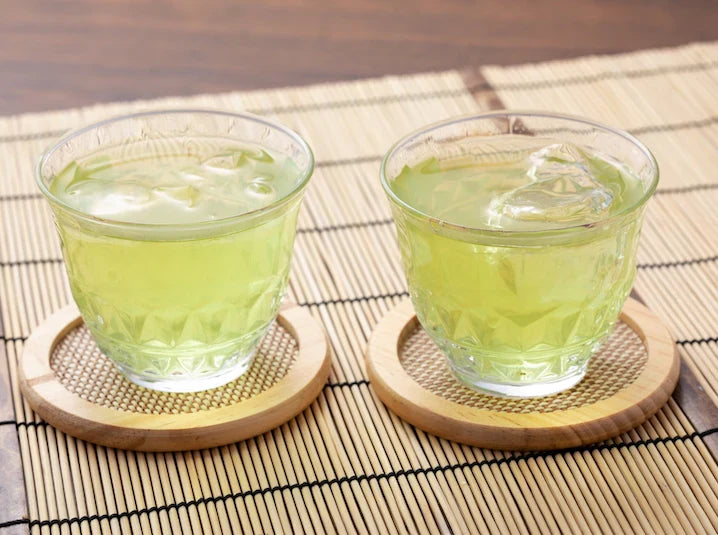 2 iced Sencha green teas on a wooden mat