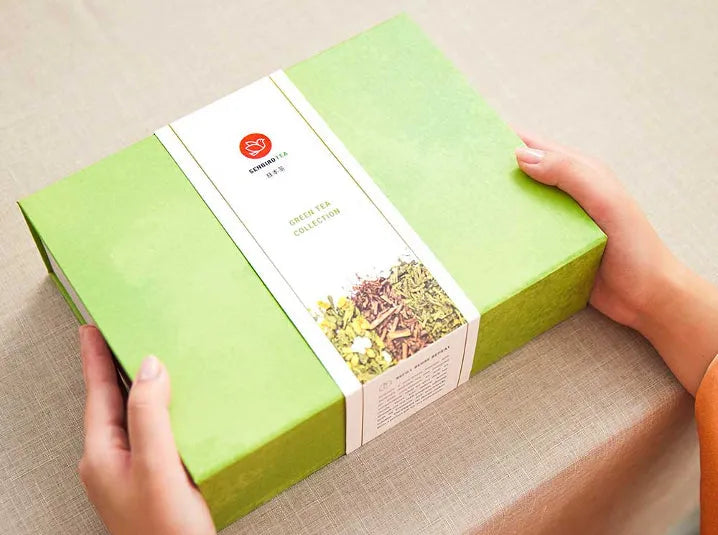 Senbird Japanese green tea gift set box held in hands with green tea collection label