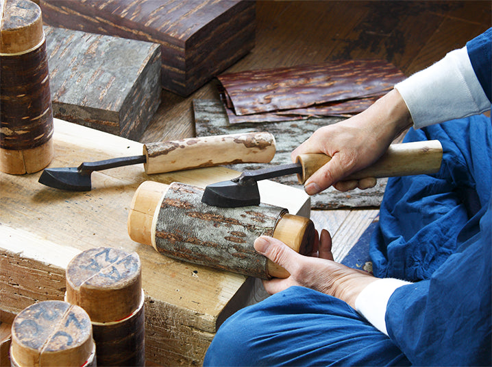 Japanese artisan crafting a cherry bark chazutsu tea canister