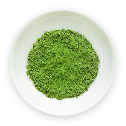Matcha Konayuki superior ceremonial grade green tea powder on white dish top view showing vibrant green matcha from Uji Kyoto Japan bulk 500g by Senbird Tea