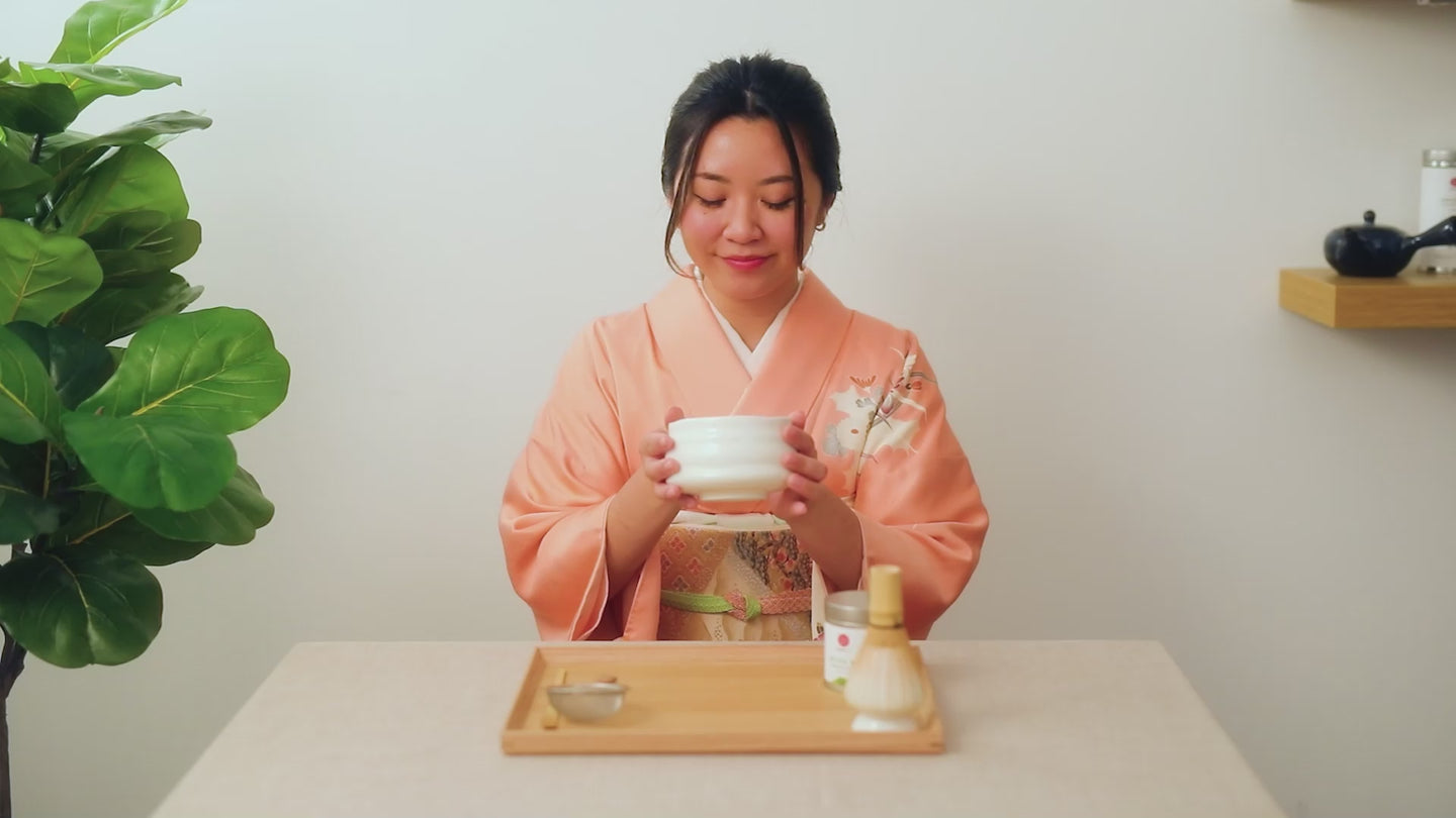 A girl wearing kimono drinking tea video