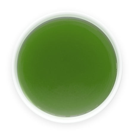 Prepared Aojiru Japanese green juice in a white cup viewed from above