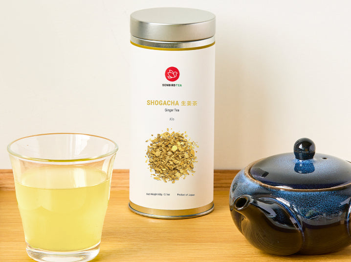 Blue kyusu teapot with Shogacha caffeine-free ginger herbal tea and glass cup