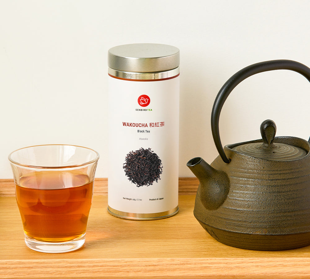 Wakoucha Japanese tea tin with red brew and cast iron teapot
